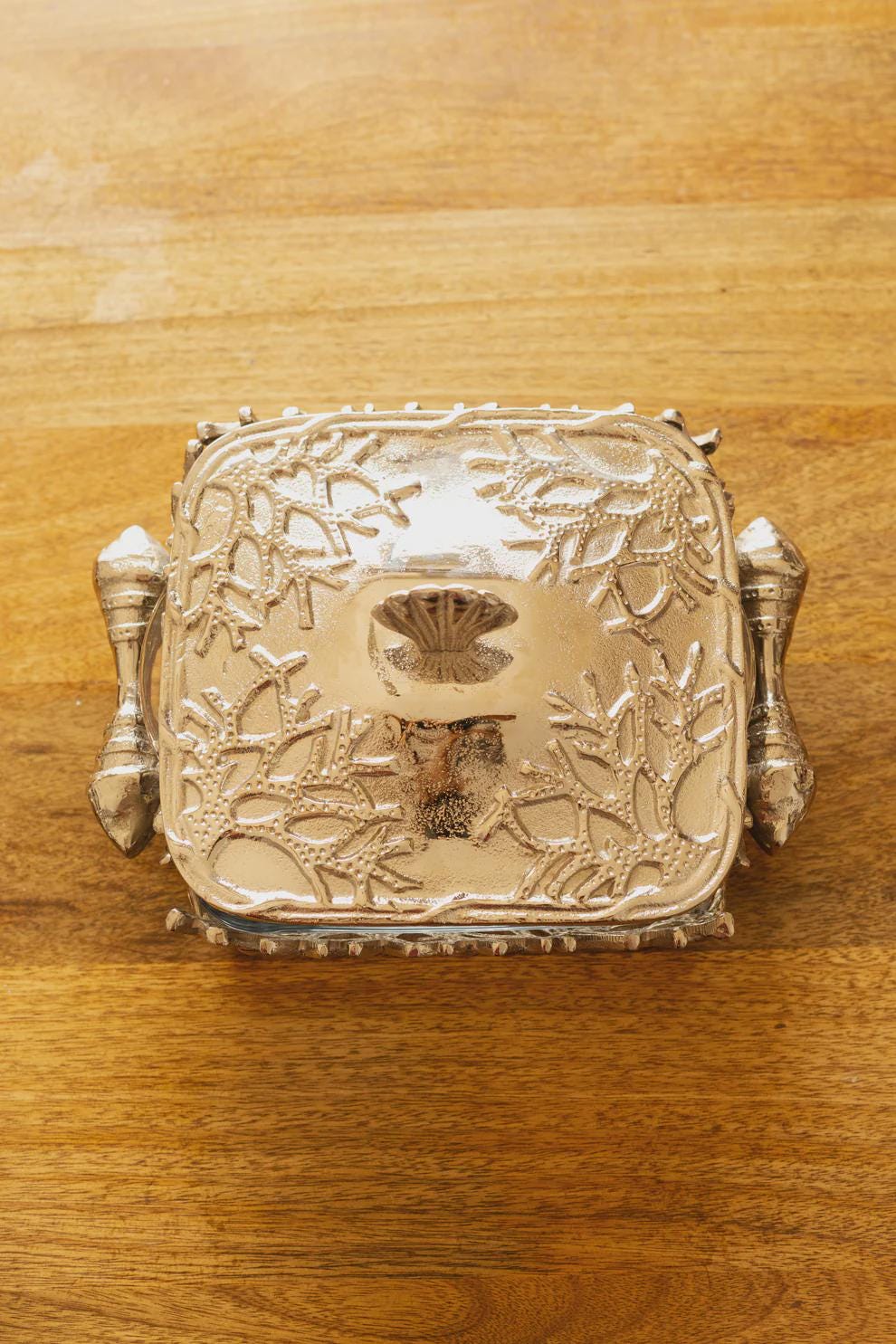Coastal themed casserole dish, featuring a glass bottom and metal lid and stand